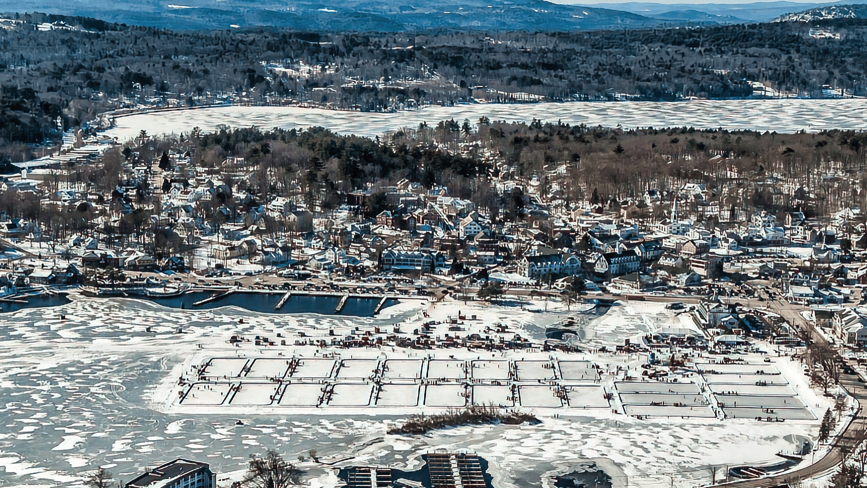 Winter lake scene with snow and ice fishing