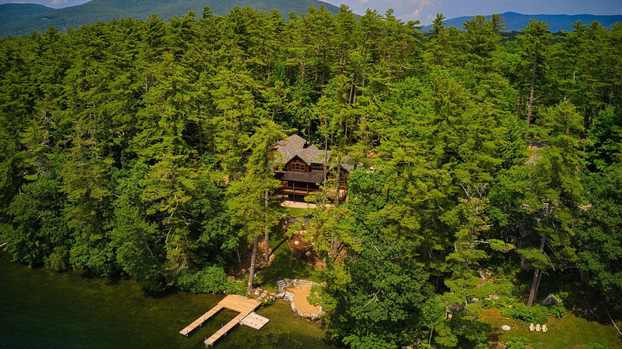 Moultonborough luxury estates with mountain backdrop and expansive lake frontage